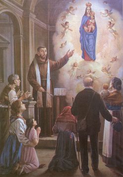 P. CArlo che accoglie i pellegrini e li benedice davanti alla Madonna